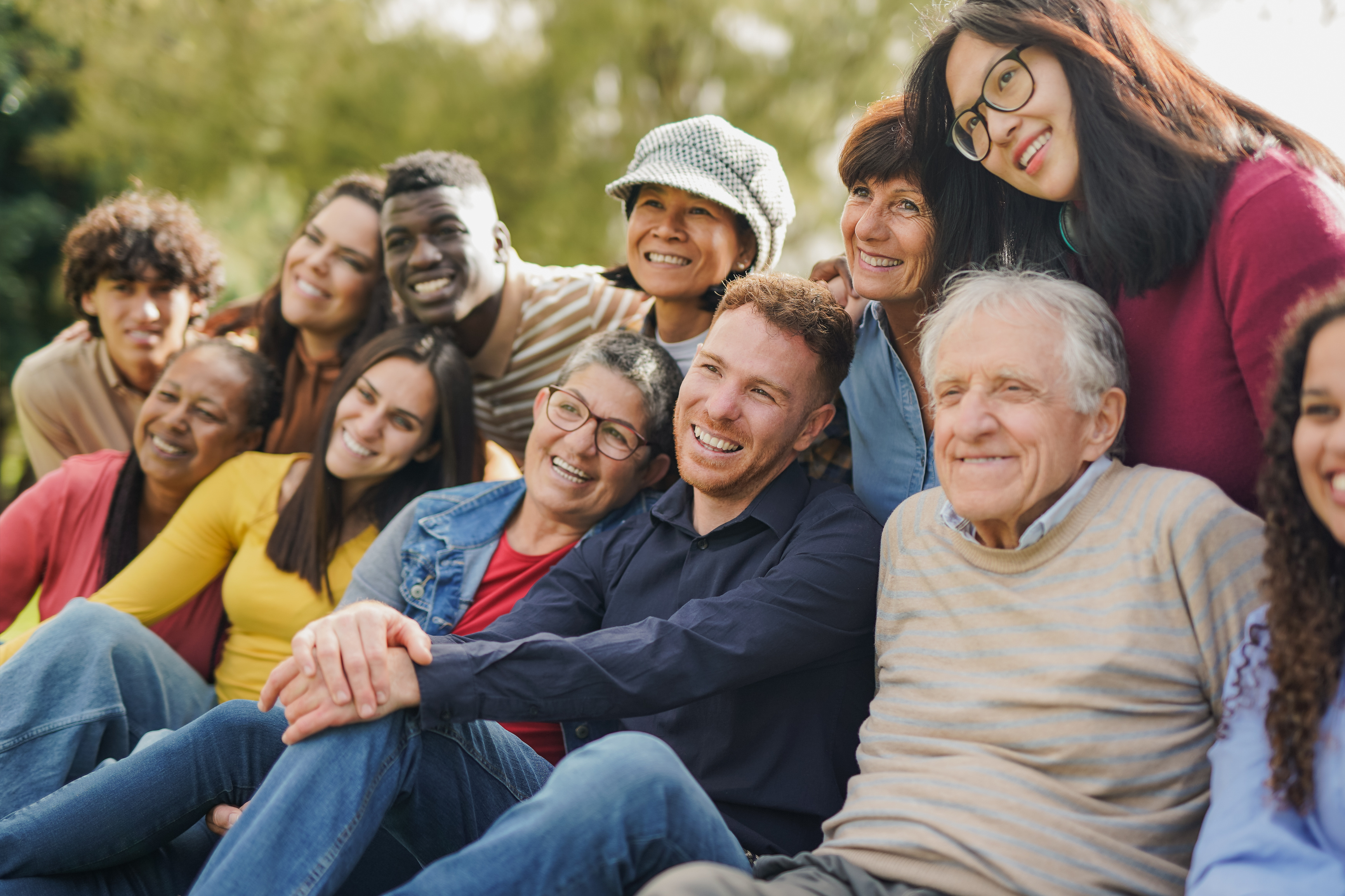 Group of Multiracial people of different ages having fun together at a city park